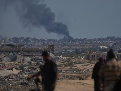 Smoke rises to the sky following an Israeli military strike in Gaza City, as seen from the central Gaza Strip, Thursday, October 2, 2025. (AP Photo/Abdel Kareem Hana)