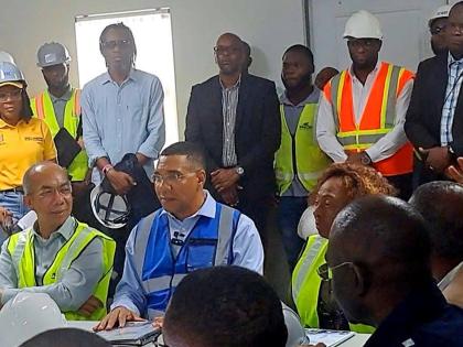 Prime Minister Dr Andrew Holness (centre) is flanked by National Security Minister Horace Chang (left) and St Catherine Central Member Parliament Olivia Grange following a tour of the multimillion-dollar St Catherine North Divisional Headquarters in Spanis