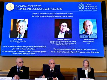 On screen (from left) are Joel Mokyr, Philippe Aghion and Peter Howitt, winners of the Nobel Memorial Prize in Economics, October 13, 2025.