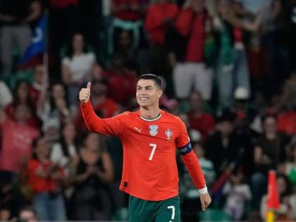 Portugal's Cristiano Ronaldo celebrates after scoring during a World Cup 2026 group F qualifying football match between Portugal and Hungary in Lisbon, Tuesday, October 14, 2025. (AP Photo/Armando Franca)