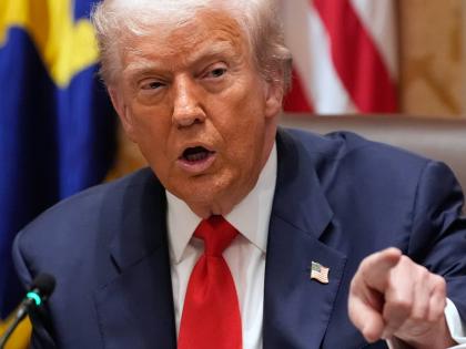 President Donald Trump speaks during a meeting with Argentina's President Javier Milei in the Cabinet Room of the White House, Tuesday, October 14, 2025, in Washington. (AP Photo/Alex Brandon)