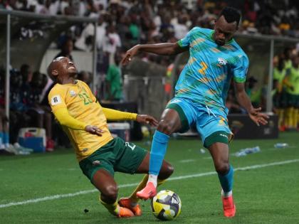 Rwanda's Claude Niyomugabo (right) stops South Africa's Thapelo Morena during a World Cup 2026 group C qualifying football match at Mbombela Stadium, in Nelspruit, South Africa, yesterday.