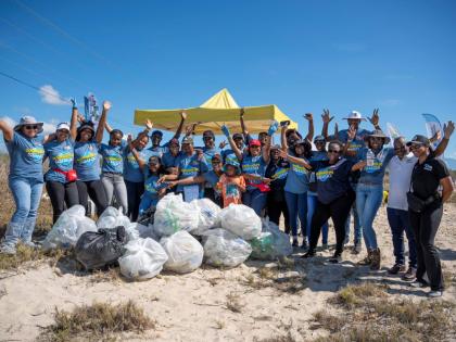 Some of the team members from Jamaica Broilers Group and its Best Dressed Chicken and Hi-Pro divisions, alongside NEPA’s Leonard Francis (second right), chief executive officer, and Monique Curtis (right), manager of Ecosystems Management Branch, after t