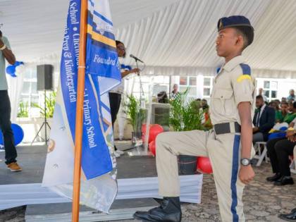 A Cornwall College cadet participating in the flag ceremony during the proclamation event.