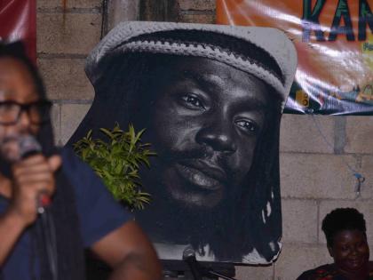 A portrait of Peter Tosh hung up in the yard of The Compound on Tuesday night.
