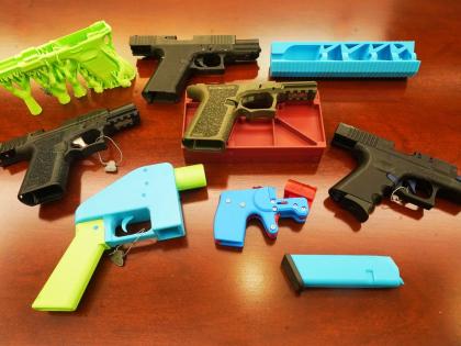 Ghost guns, provided by the New York City Police Department, are displayed in the Manhattan District Attorney's office, in New York, Wednesday, October 15, 2025. (AP Photo/Richard Drew)