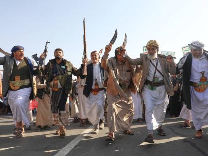 Houthi supporters dance as they celebrate following the announcement that Israel and Hamas have agreed to the first phase of a peace plan to pause the fighting, in Sanaa, Yemen.