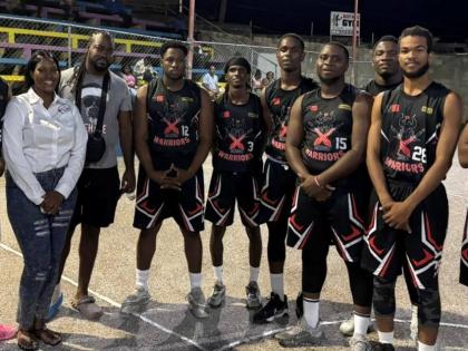 President of the St James Arise Basketball League Nyame Frater (left) and main sponsor Ryan Gardner (second left) of SoSo Water stand alongside members of the defending champions Montego Bay Boys’ Club Warriors team during the launch of the competition o