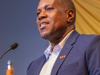 Paul Elliott, CEO, VM Building Society, delivers remarks at a diaspora forum in Florida in April. 