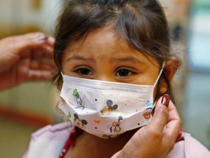 
Lucile Packard Children’s Hospital at Stanford visitor Sheila Garciacwears before visiting a patient at the hospital in Palo Alto, California, in October 2009.