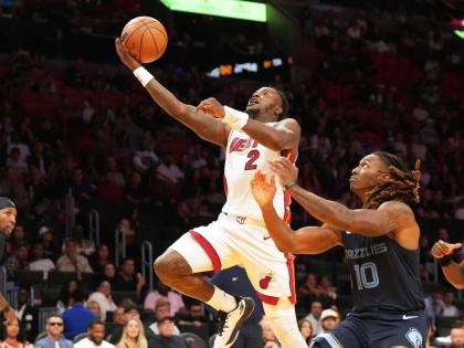 Miami Heat guard Terry Rozier (2) drives to the basket as Memphis Grizzlies guard Javon Small (10) defends during the second half of an NBA preseason basketball game Friday, October 17, 2025, in Miami. 