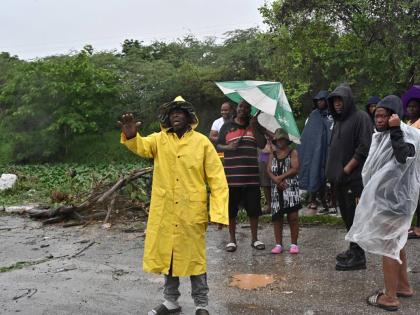 Waterford residents protest neglect of Adair Drive gully ahead of Hurricane Melissa on Monday.
