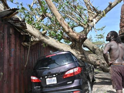 A man looks at damage caused by Hurricane Melissa in St Ann’s Bay.