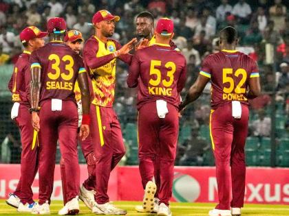 Photo courtesy CWI Media 
Jason Holder (third right) celebrates with teammates from left: Alick Athanaze, Jayden Seales, Shai Hope, Roston Chase, Brandon King and Rovman Powell after taking a wicket, during the second T20I at the Bir Sreshtho Flight Lieute
