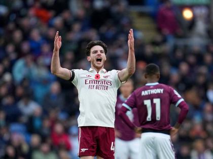Arsenal’s Declan Rice celebrates after scoring his side’s second goal during the English Premier League soccer match against Burnley in Burnley, England, yesterday. Arsenal won 2-0.