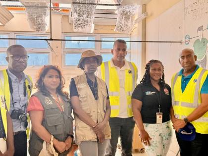 Executive Director of the Caribbean Disaster Emergency Management Agency (CDEMA) Dr Lisa Indar (second left) standing with high-level delegates from the agency, the Caribbean Development Bank and the Caribbean Institute for Meteorology and Hydrology follow
