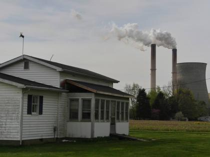 A home sits near a coal-fired power plant, April 14, 2025, in Cheshire, Ohio.
