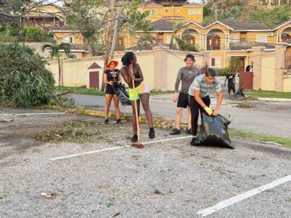 Employees of Hah-R-Mony Entertainment Limited assist with post-Hurricane Melissa cleanup efforts in Montego Bay, St James.