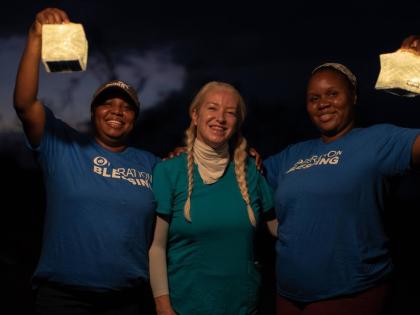 Dr Alison Thompson (centre) flanked by two Operation Blessing volunteers. 