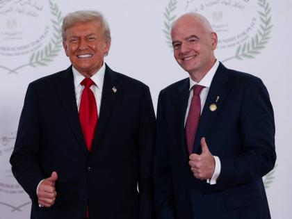 President Donald Trump (left) and FIFA President Gianni Infantino pose for a photo in Sharm el-Sheikh, Egypt on Monday, October 13.