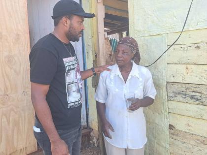 Carl Grant, councillor for the Lluidas Vale Division in St Catherine, seeks to reassure resident Sharon Small, whose one-bedroom house was blown away by Melissa’s outer bands.
