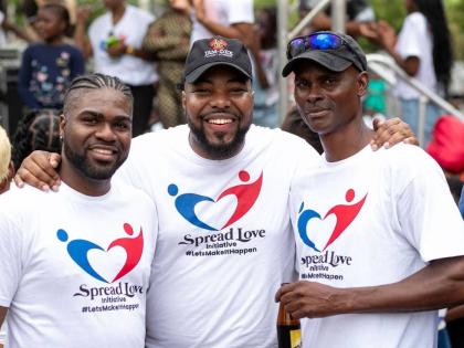 Rajae Danvers (centre), founder and executive director of the Spread Love Initiative, stands proudly with leaders in the community, Garrett Cooper (left) and Peter Nash.