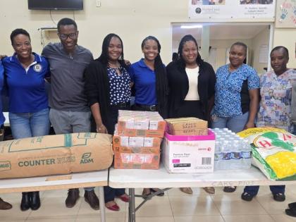 Members of Mount Pleasant Football Academy and Jacob’s Ladder pose for a photograph following the club’s donation of supplies recently.
