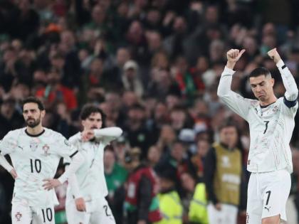 Portugal's Cristiano Ronaldo, right, leaves the pitch after being shown a red card during a World Cup 2026 group F qualifying soccer match between Ireland and Portugal in Dublin, Thursday, November 13, 2025. (AP Photo/Peter Morrison)