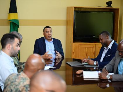 Prime Minister, Dr Andrew Holness (centre), addressing stakeholders during a meeting at the Office of Disaster Preparedness and Emergency Management (ODPEM) in St Andrew on November 12. Participating in the session are ODPEM Director General, Commander Alv