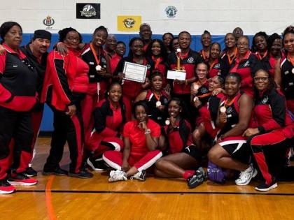 Police Nationals’ delegation poses after winning bronze in the Championship Division of the Florida United Netball Extravaganza at the Miramar Youth Enrichment Center in Florida yesterday.