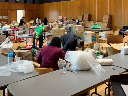 Volunteers sort through hurricane relief supplies at one of the Silver Spring, Maryland, drop off centres.