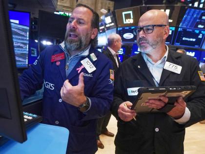 Specialist Michael Pistillo, left, and trader Fred Demarco work on the floor of the New York Stock Exchange. (AP)