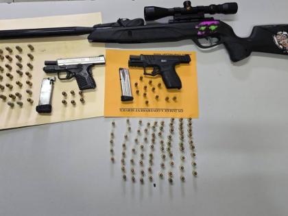Guns and ammunition seized by the police in Parry Town, St Ann on November 24, 2025.