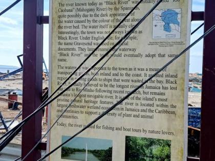 The storyboard of the history of Black River is still standing after Hurricane Melissa.