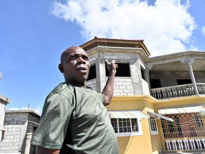 Wayne Wheatley, displaced by Storm Gustav, stands proudly outside his home in West Albion, St Thomas.