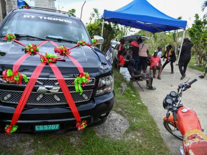 Photos by Antoine Lodge
Family and friends gather in Westmoreland for a repast following the funeral of Cleveland Jeffery, lost during Hurricane Melissa.