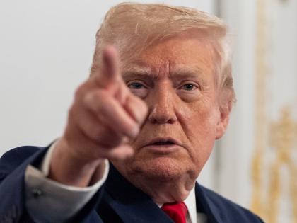 President Donald Trump speaks to reporters after speaking to troops via video from his Mar-a-Lago estate on Thanksgiving, Thursday, November 27, 2025, in Palm Beach, Florida.(AP Photo/Alex Brandon)