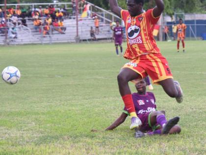 Ashley Anguin/Photographer 
Cornwall College’s Carlondo Morris (right) evades the challenge of William Knibb Memorial’s Gawen Marley during their round-of-16 ISSA daCosta Cup game at the Drax Hall Sports Complex in St Ann yesterday.