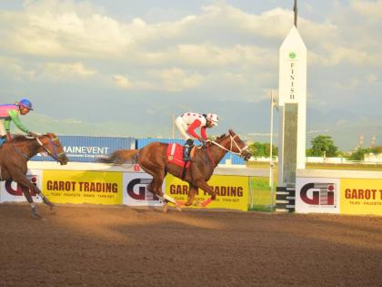 Anthony Minott/Freelance Photographer 
CALIFORNIA CROWN, ridden by Robert Halledeen, wins the Kaz Hosay Trophy ahead of ZULU WARRIOR (Raddesh Roman) over five-and-a-half furlongs at Caymanas Park yesterday.