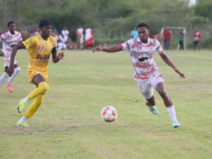 Orel Miller (right) of Glenmuir High powers past Garvey Maceo High’s  Tyreek McKenley during a first-round bottom-of-the-table daCosta Cup clash at Garvey Maceo on Tuesday, September 30. Glenmuir won 4-0. 