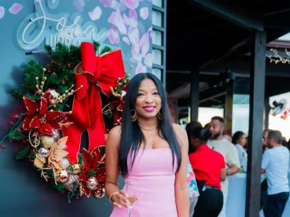 Realtor Kellie-Ann Brown rocks a pink mini for the occasion.