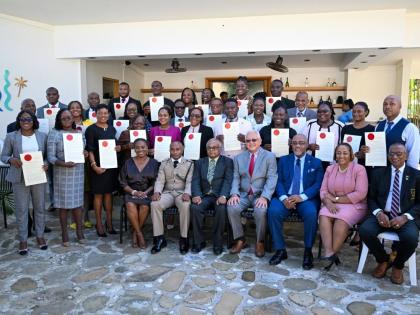 Minister of Justice and Constitutional Affairs, Delroy Chuck (seated centre), and Custos of St Mary, Errol Johnson (seated, third left), with newly minted justices of the peace of St Mary, during the commissioning ceremony held in Port Maria.