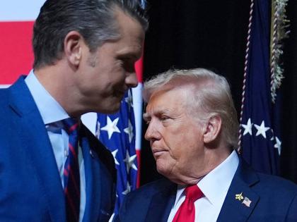 US President Donald Trump (right) and Secretary of Defense Pete Hegseth.