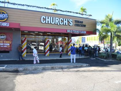 Persons mill around at the opening of the Church’s Texas Chicken fast-food eatery, at the opening of the franchise’s first store at Mall Plaza, Constant Spring Road, Kingston, on December 8, 2025.