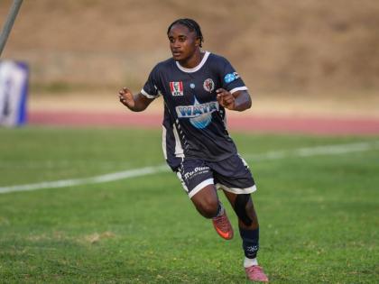 Jamaica College’s (JC) Jabarie Howell celebrates scoring one of the two goals he had against Charlie Smith during an ISSA/WATA Manning Cup football match against Charlie Smith at the Stadium East field yesterday. JC won the game 4-0.