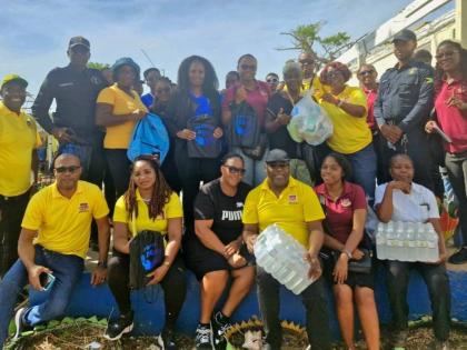 Members of the Friends of Region 6 are joined by Jamaica Constabulary Force personnel and educators during a visit to the Brampton Primary and Infant School in St Elizabeth on November 28. The group distributed hurricane relief supplies valued at over $500