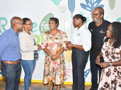 Lady Allen (third left) engages in conversation with Claudine Allen (second left), general manager, JN Foundation; Carla Myrie (third right), executive director of the Nature Preservation Foundation (NPF); Alfred ‘Frano’ Francis (second right), directo
