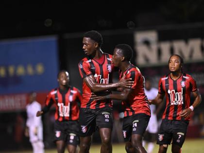 Members of the Arnett Gardens FC team celebrate a goal against Cavalier at the Anthony Spaulding Sports Complex during the 2024-25 Jamaica Premier League season.