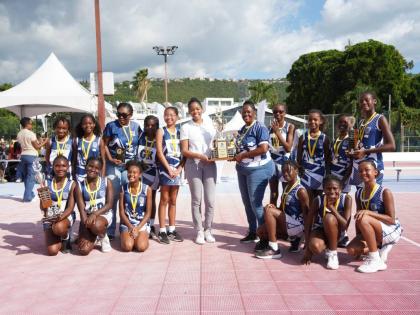 Mona Preparatory School’s under-12 netball team celebrates after securing a third straight JISA championship, following a dominant 14–4 victory over Emmanuel Christian Academy at the Leila Robinson Court, National Stadium, on Thursday.