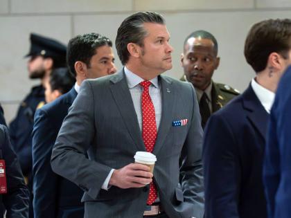United States Defense Secretary Pete Hegseth walks to the auditorium to brief members of Congress on military strikes near Venezuela at the Capitol on December 16, 2025, in Washington.